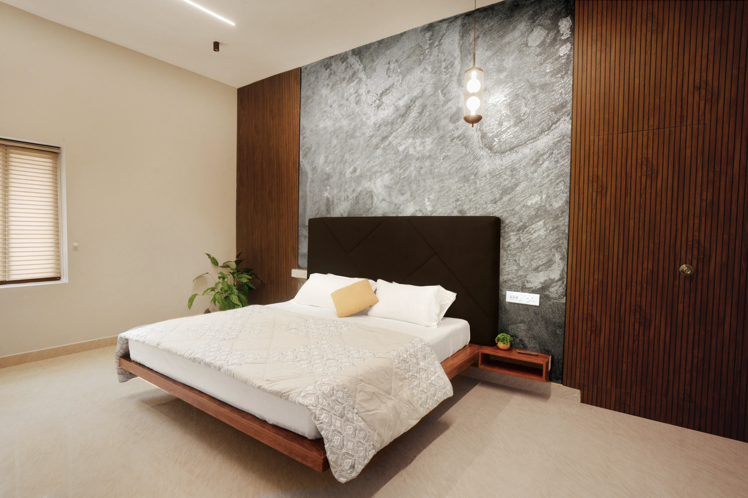 Spacious wooden bedroom featuring premium king-size bed setup
